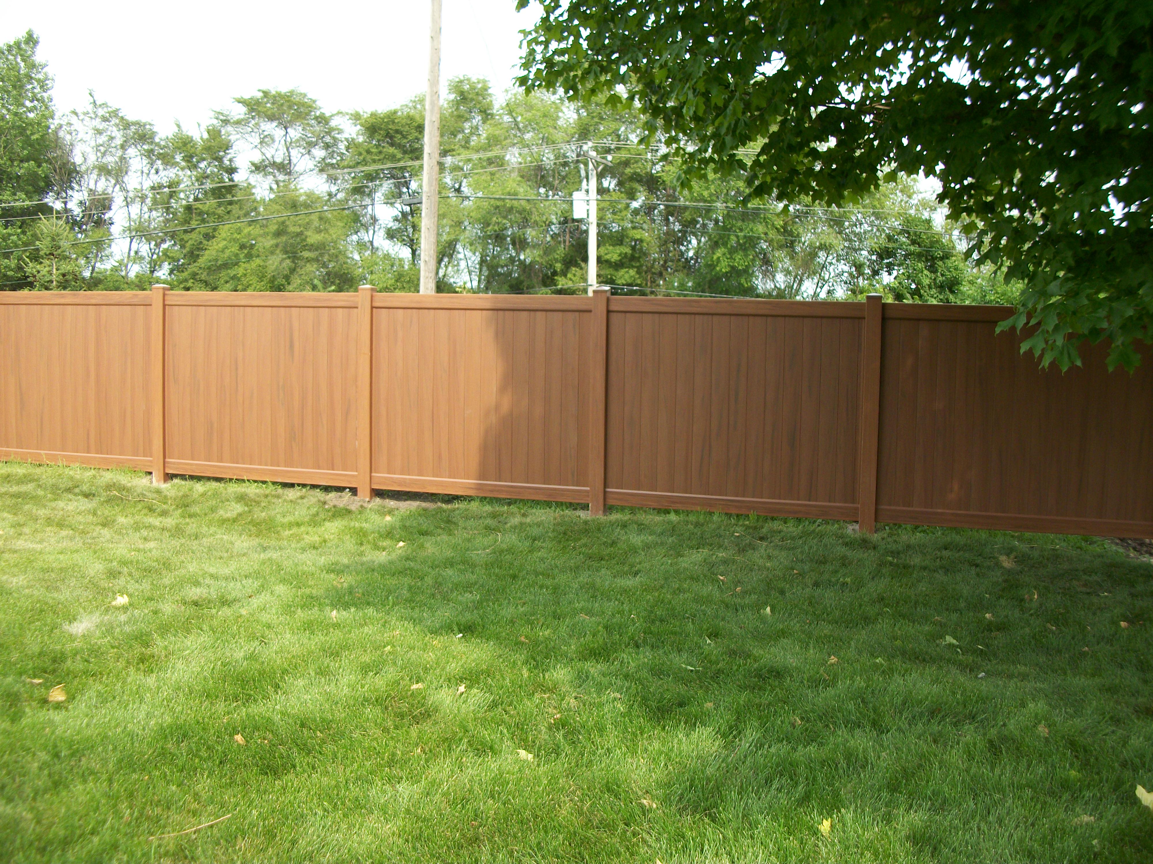 Installation of White vinyl accent privacy fence Chanhassen, Minnesota