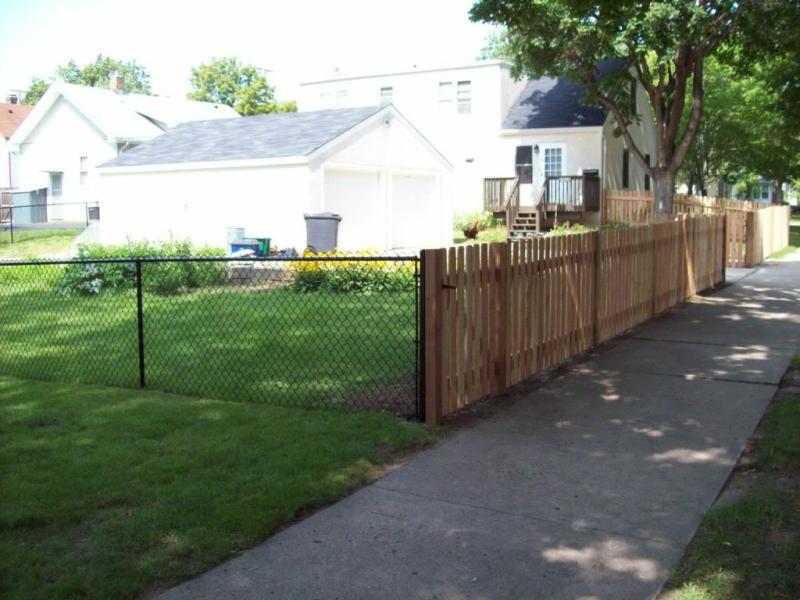 Cedar dog eared picket fence installation Minneapolis, Minnesota