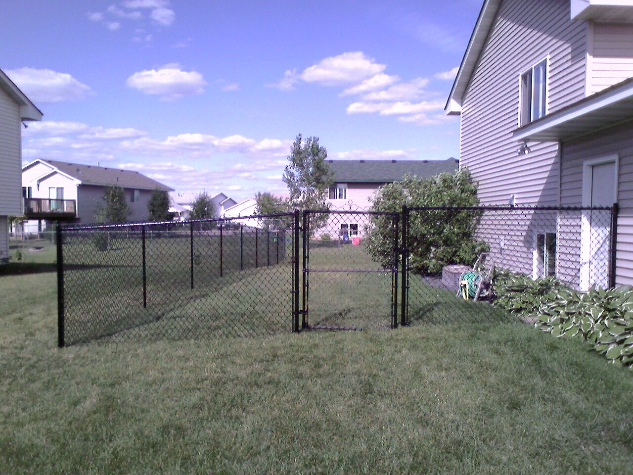 Black vinyl chain link fence installation Bell Plaine, Minnesota