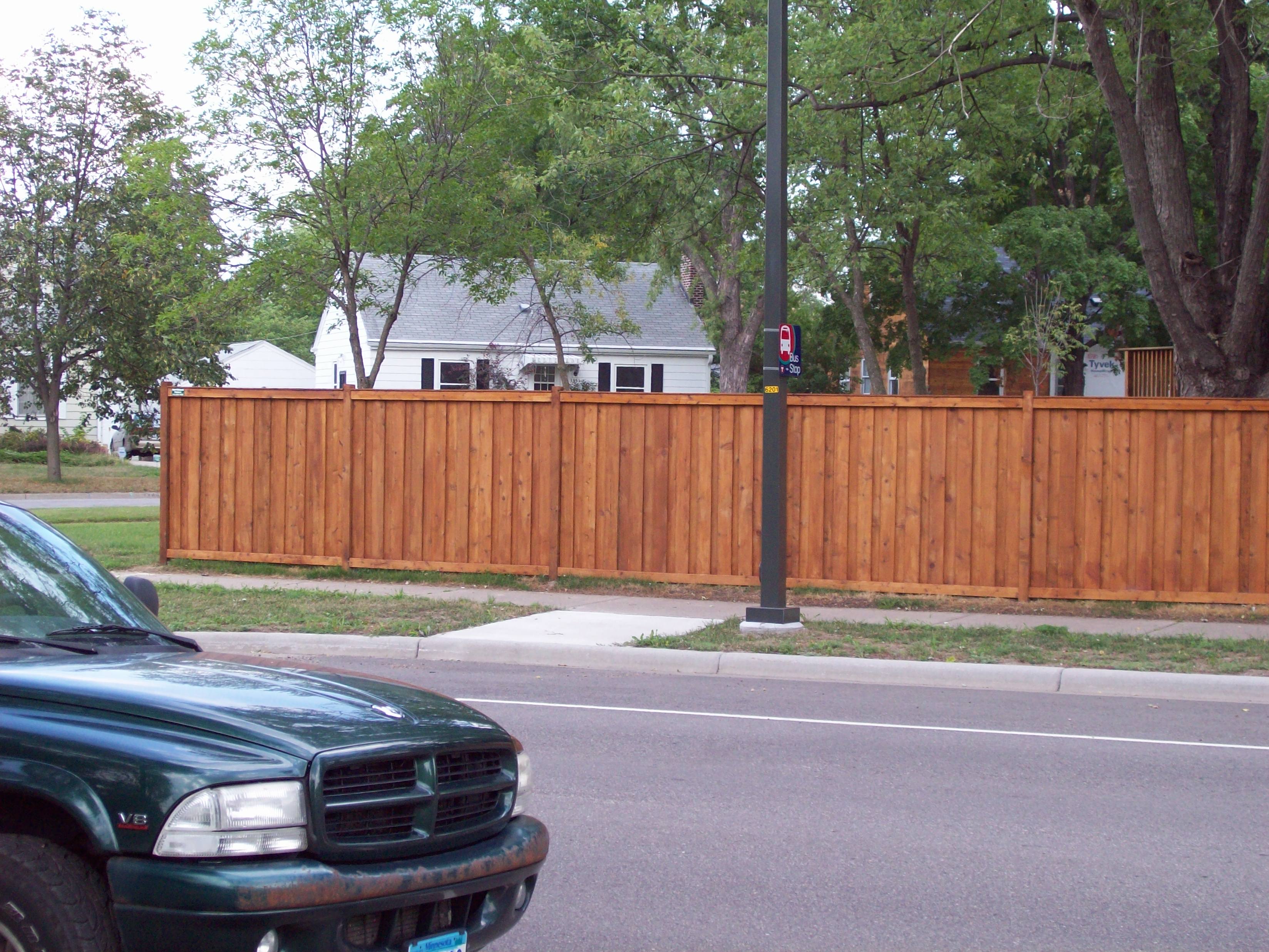 Cedar framed batten board privacy fence installation St. Louis Park, Minnesota