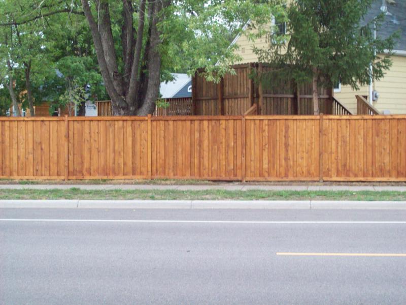 Cedar framed batten board privacy fence installation St. Louis Park, Minnesota