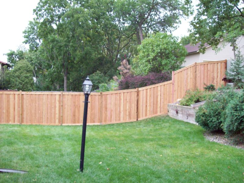 Cedar framed batten board privacy fence installation Roseville, Minnesota