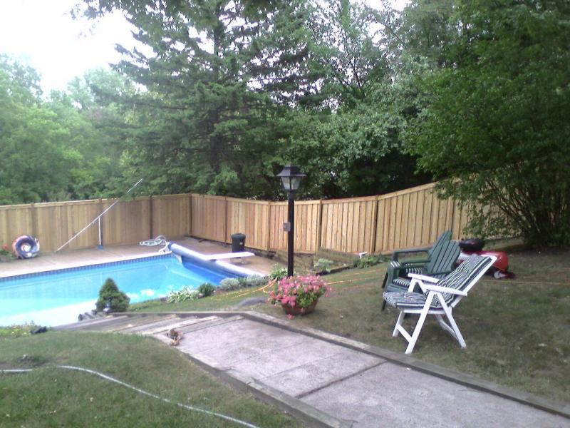 Cedar framed batten board privacy fence installation Minnetonka, Minnesota