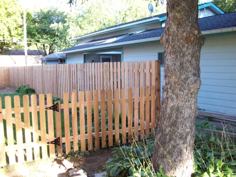 Cedar dog eared picket fence installation Hopkins, Minnesota