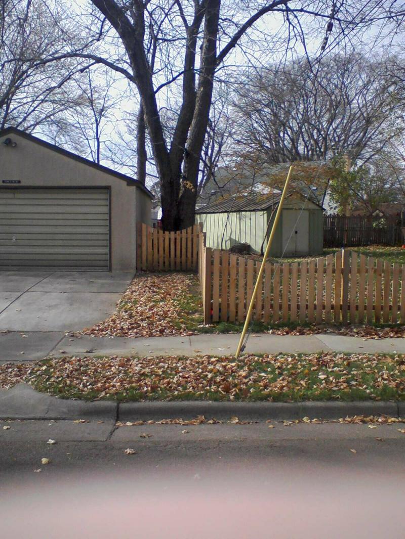 Cedar Scalloped Picket Fence Installation Minneapolis, Minnesota