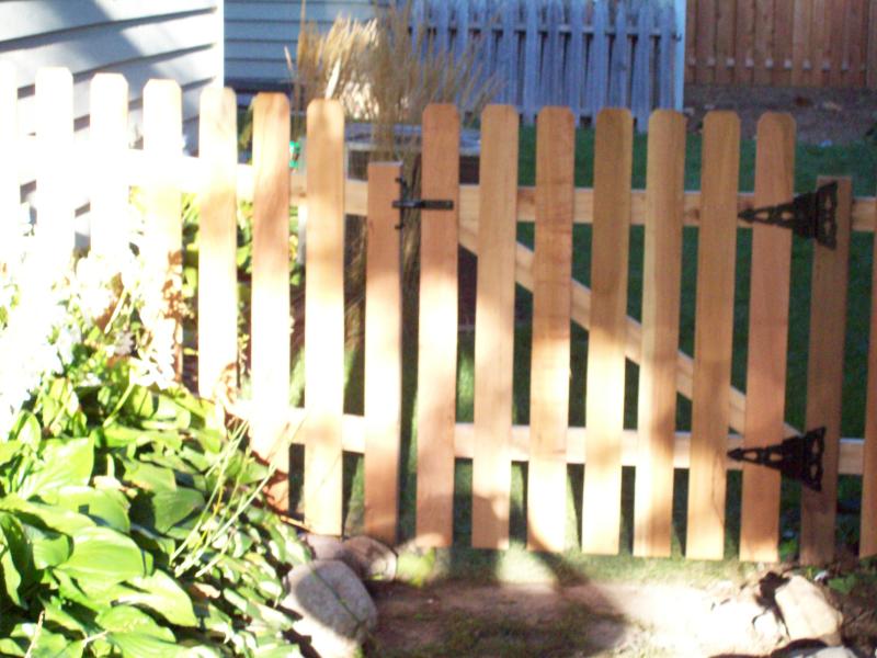 Cedar dog eared picket fence installation Hopkins, Minnesota