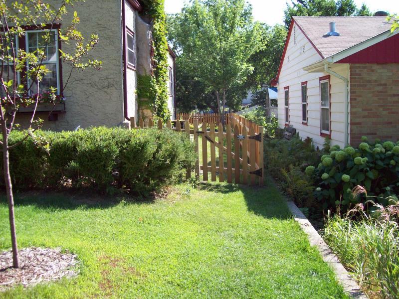 Cedar gothic picket fence installation Minneapolis, Minnesota