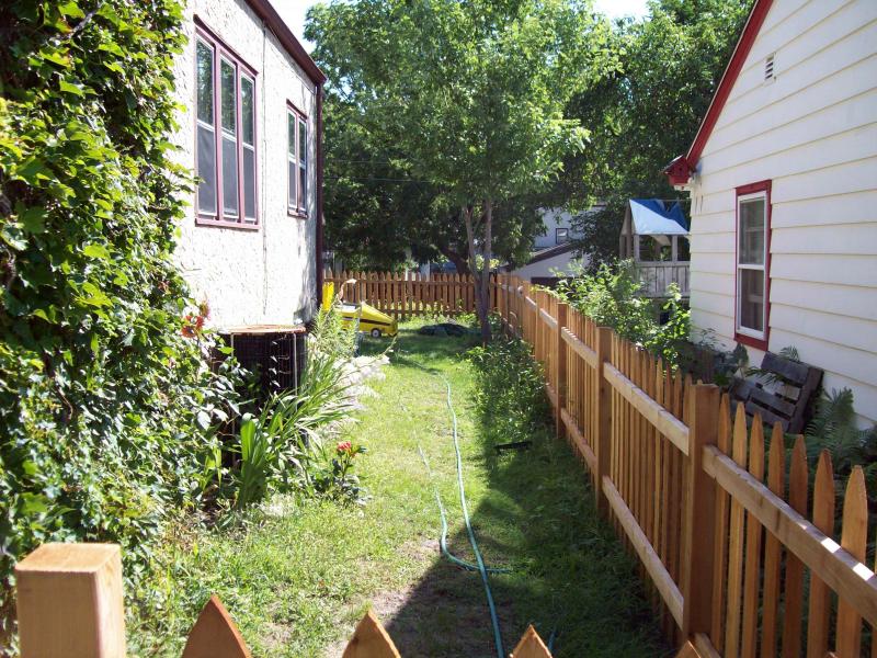 Cedar gothic picket fence installation Minneapolis, Minnesota