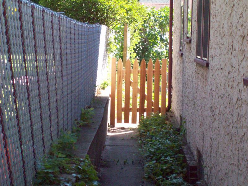 Cedar gothic picket fence installation Minneapolis, Minnesota