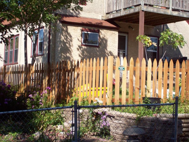 Cedar gothic picket fence installation Minneapolis, Minnesota