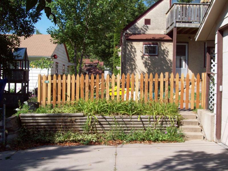 Cedar gothic picket fence installation Minneapolis, Minnesota