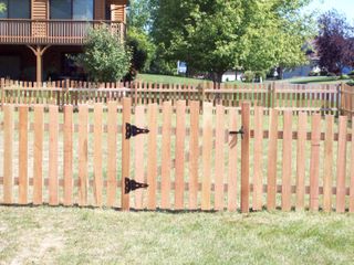 Installation of cedar scalloped picket fence Chaska, Minnesota